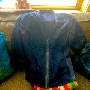 Blouse, size Large.  Tahiti.  Never worn.  Navy color.  Sleeves are to elbow.